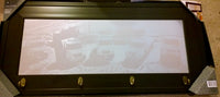 custom laser engraved photo of tow trucks on a wood framed mirror.